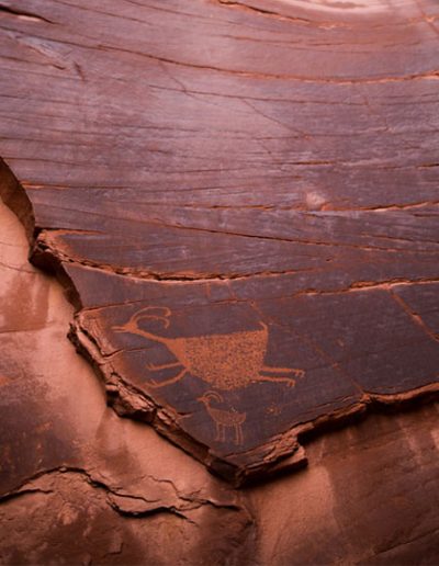 Ancient carvings on rock wall